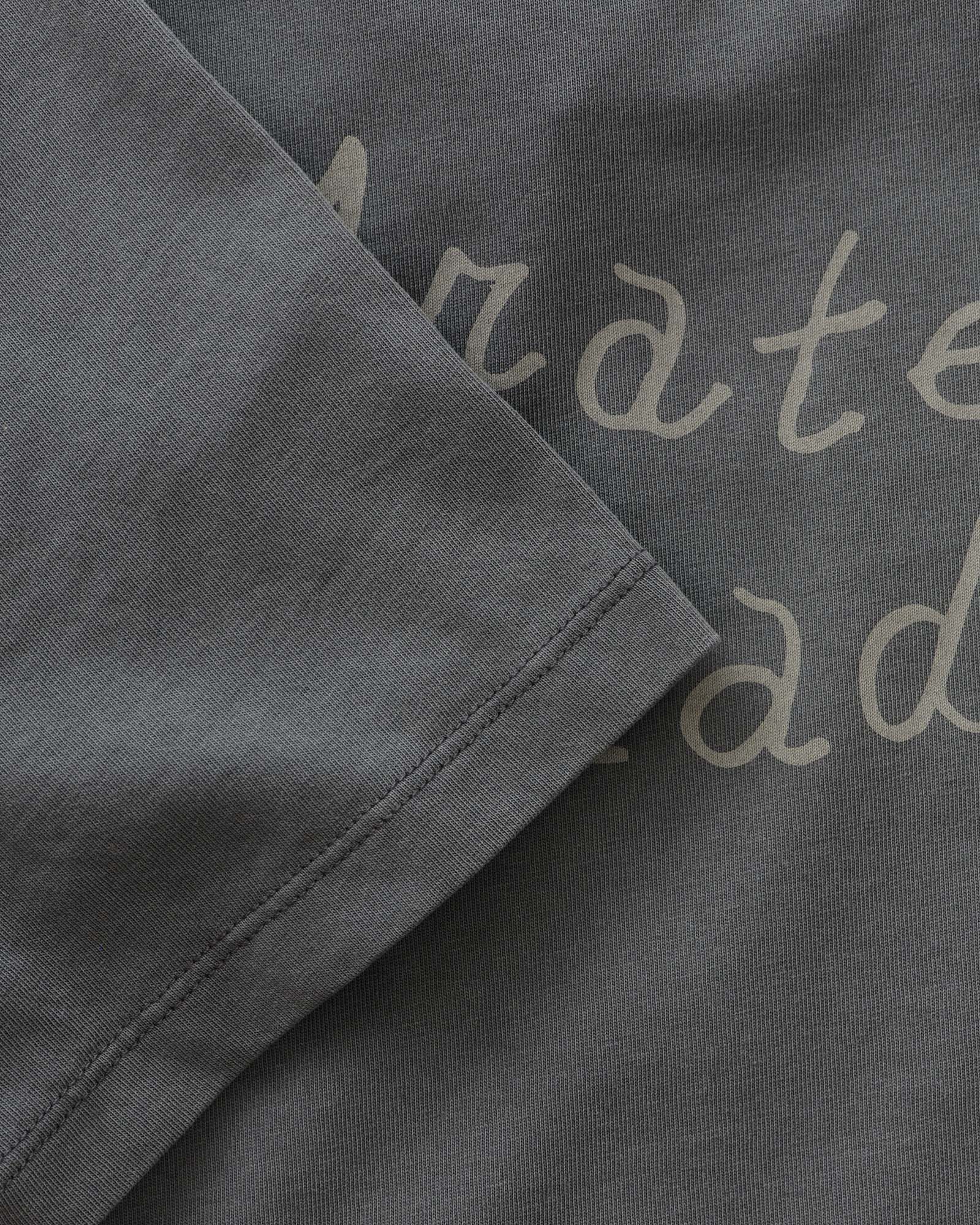 material shot of the sleeve on The Organic Cotton Tee in Dead Script, Knits by Taylor Stitch