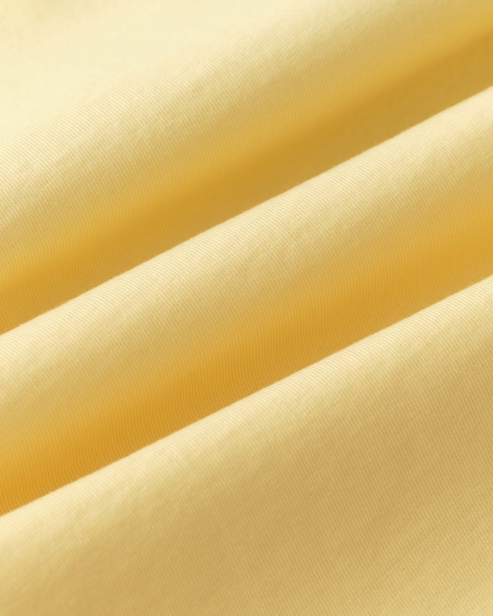 material shot of the fabric on The Organic Cotton Tee in Lemon Stamp, Knits by Taylor Stitch
