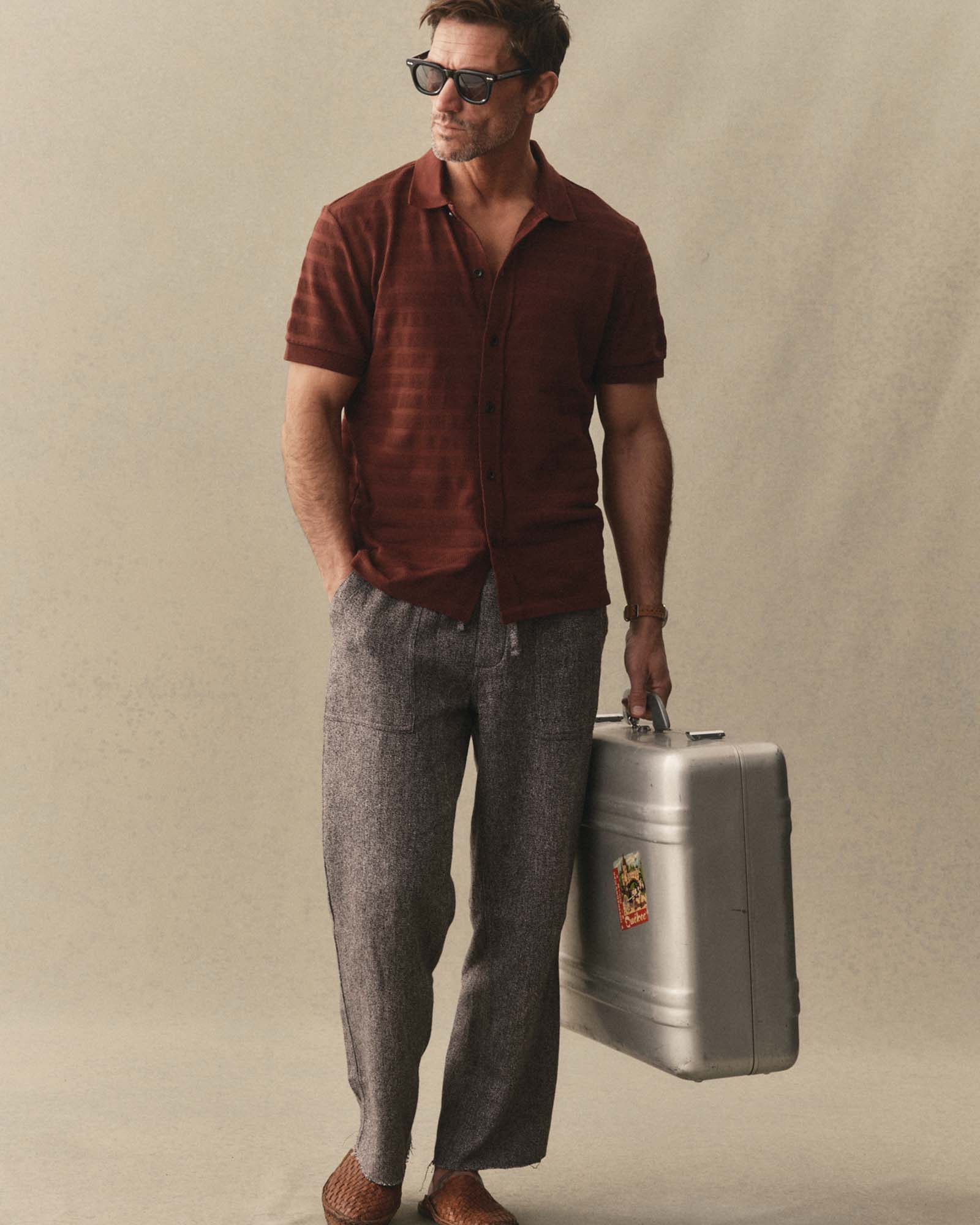 fit model walking wearing The Bywater Polo in Burgundy Knit Stripe, Knits by Taylor Stitch