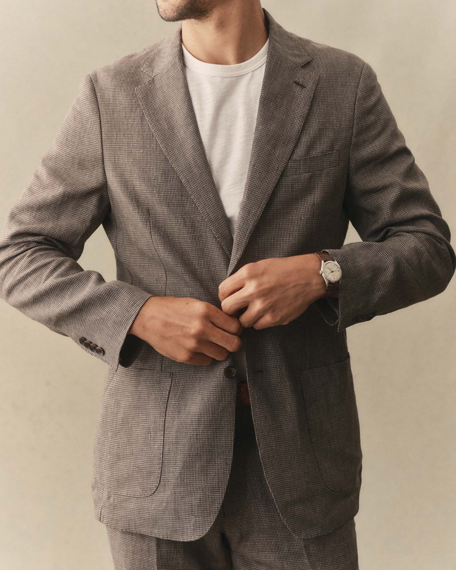 fit model posing in The Stevens Sportcoat in Morel Micro Check, Outerwear by Taylor Stitch