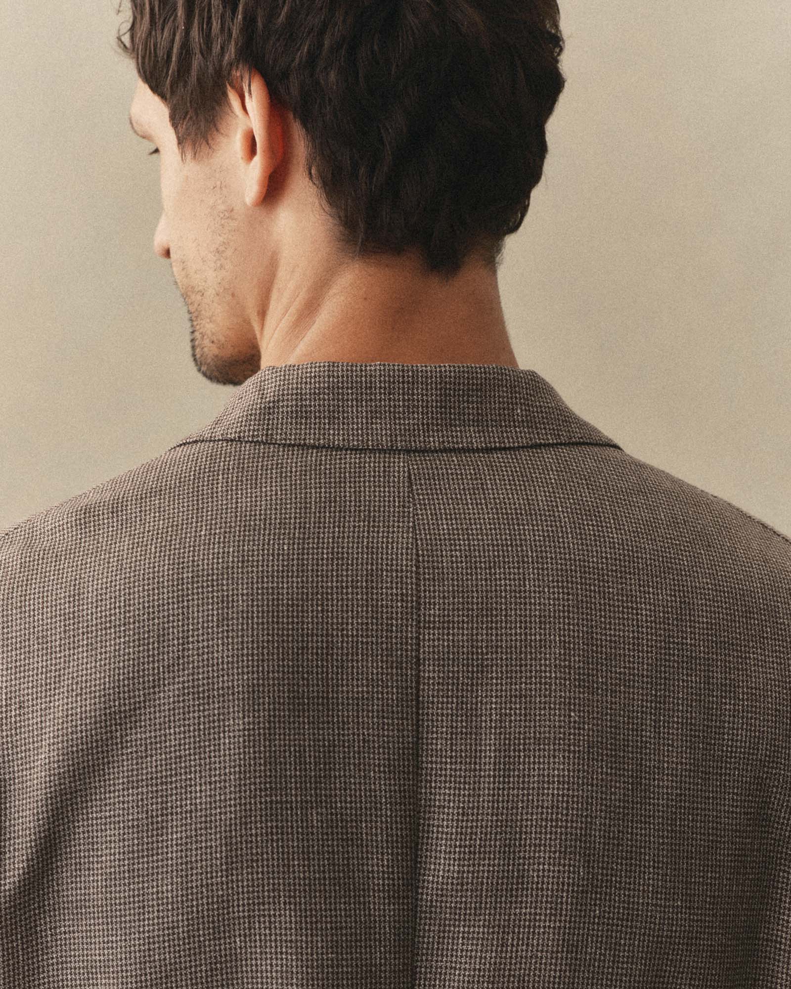 fit model showing off the back of The Stevens Sportcoat in Morel Micro Check, Outerwear by Taylor Stitch