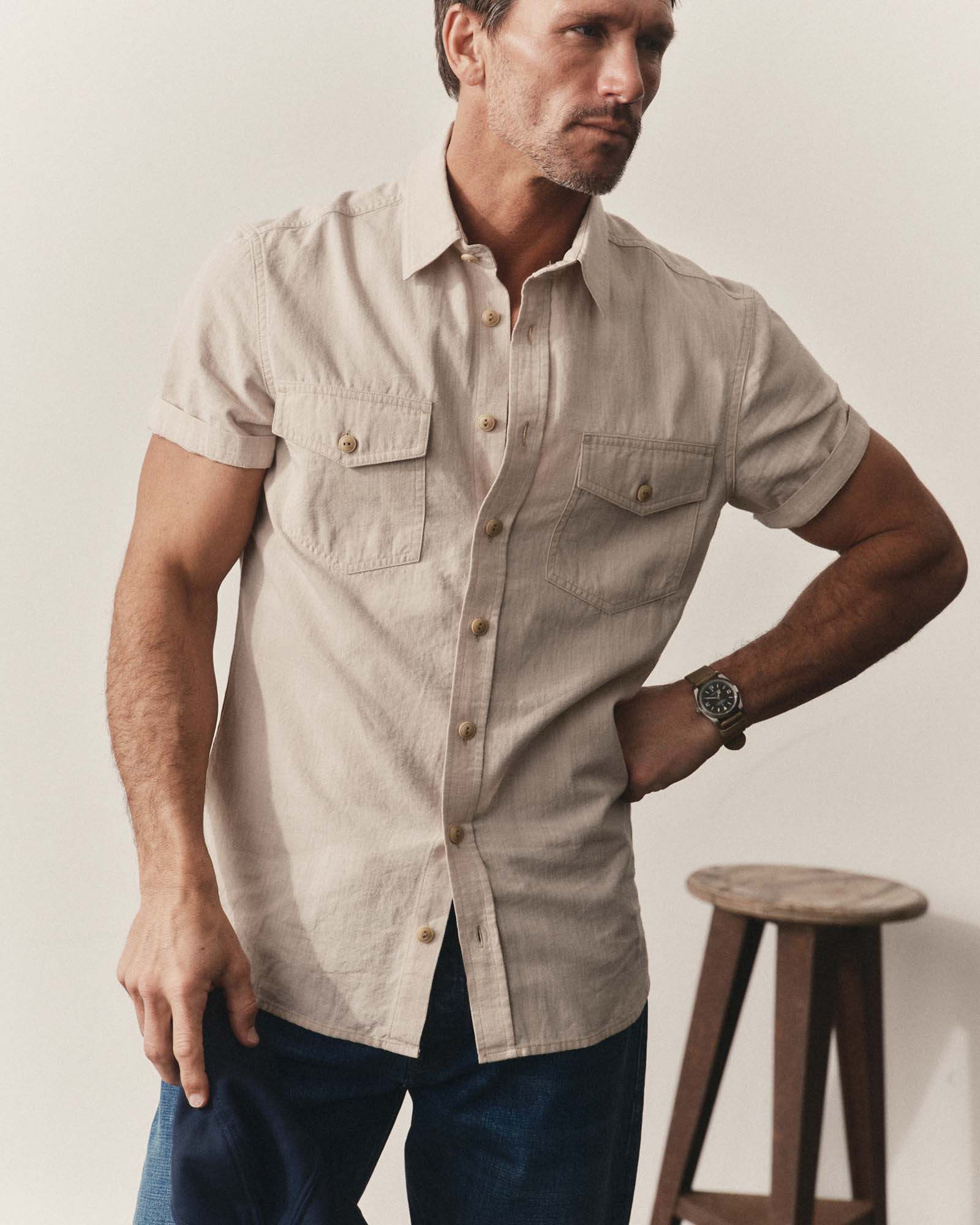 fit model showing off The Short Sleeve Crew Shirt in Natural Chambray, Wovens by Taylor Stitch