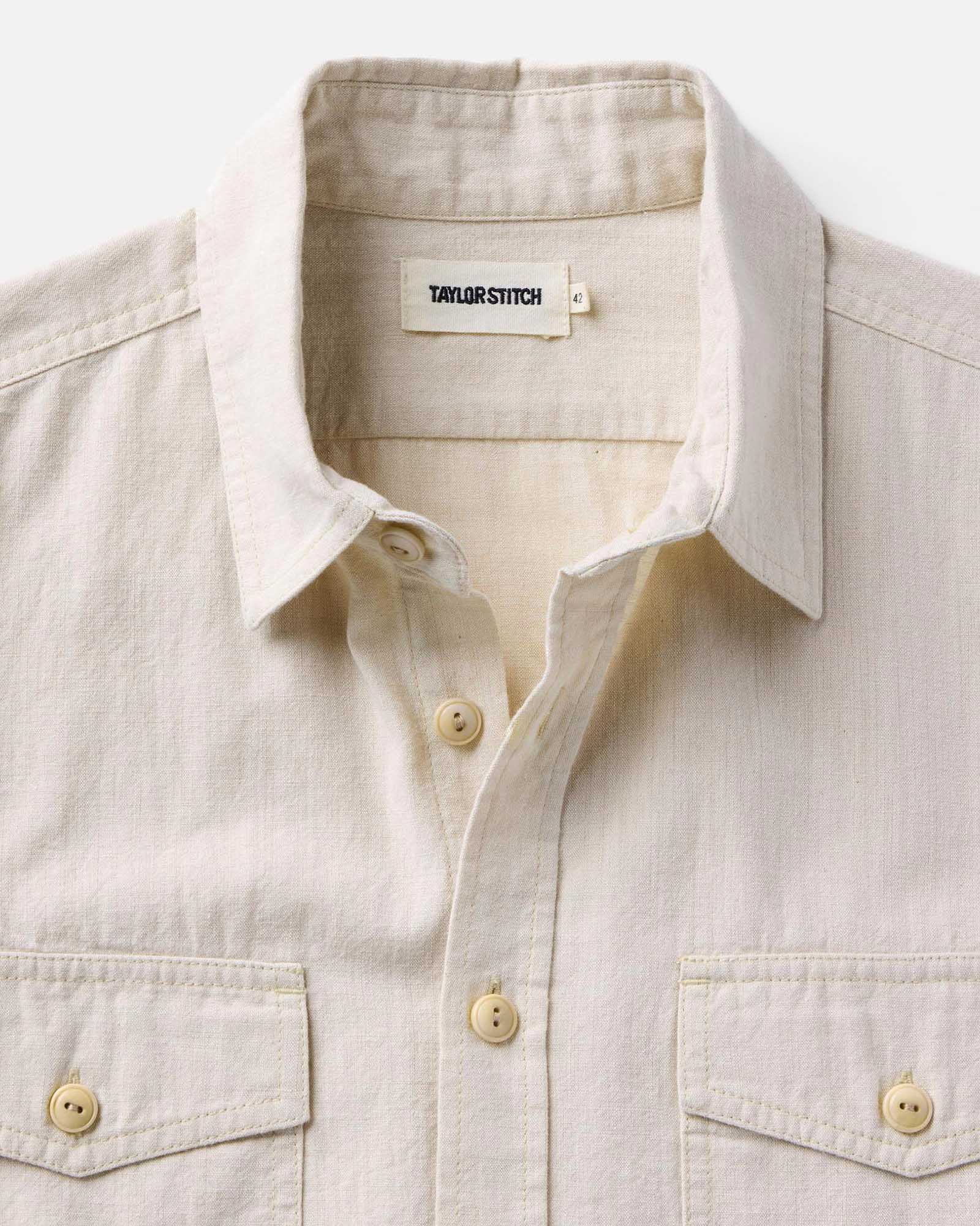material shot of the collar on The Short Sleeve Crew Shirt in Natural Chambray, Wovens by Taylor Stitch