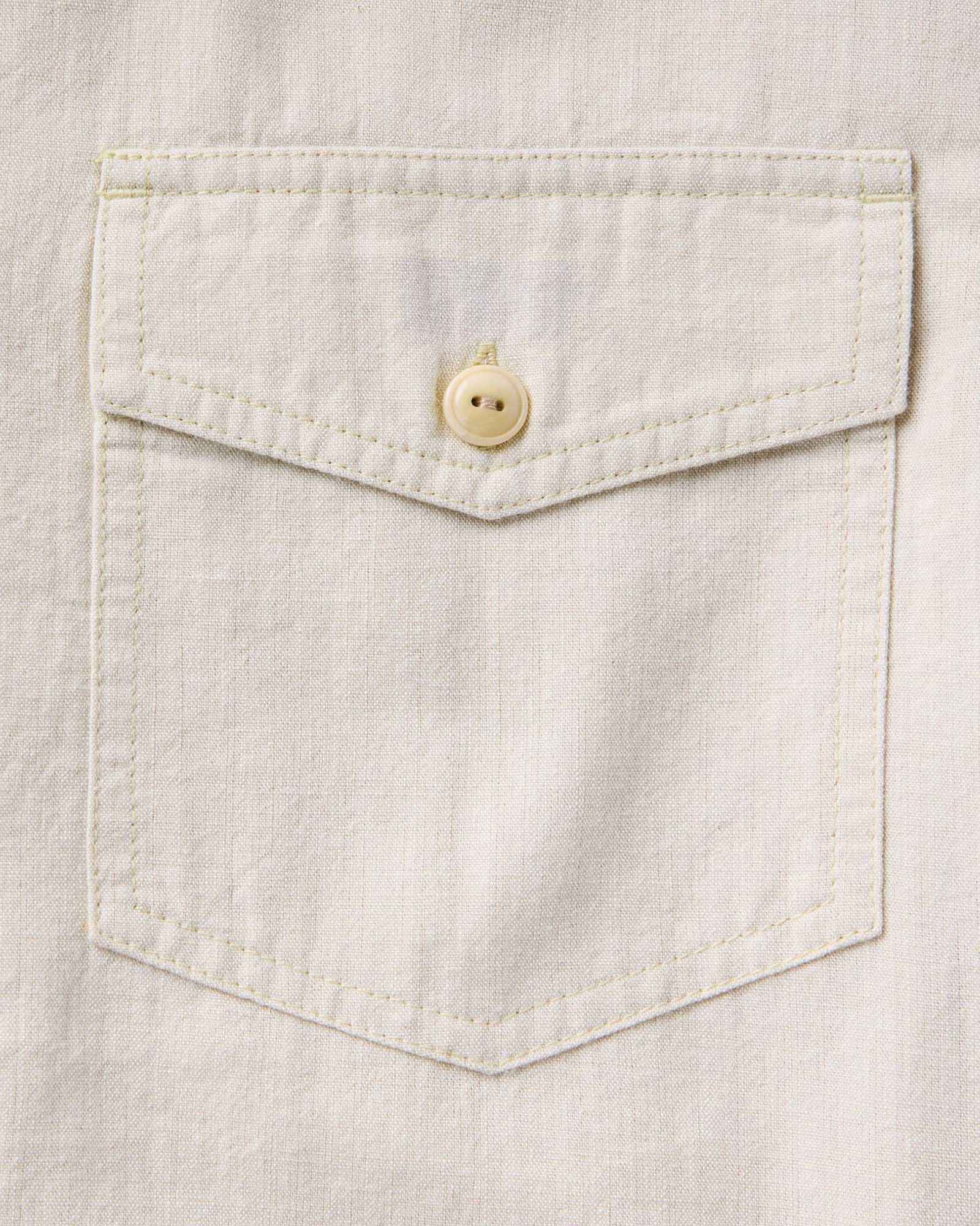 material shot of the pocket on The Short Sleeve Crew Shirt in Natural Chambray, Wovens by Taylor Stitch