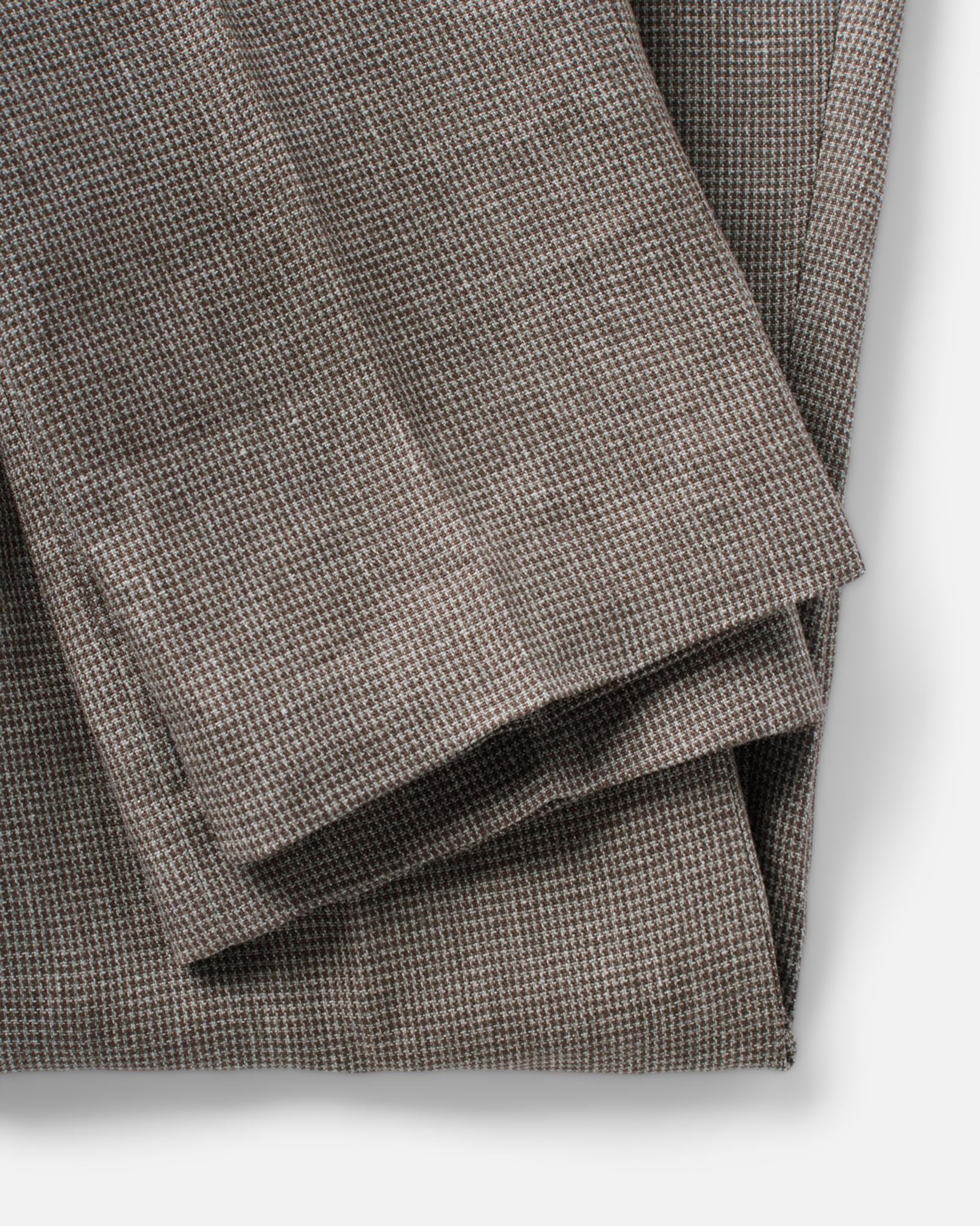material shot of the hem on The Stevens Trouser in Morel Micro Check, Bottoms by Taylor Stitch