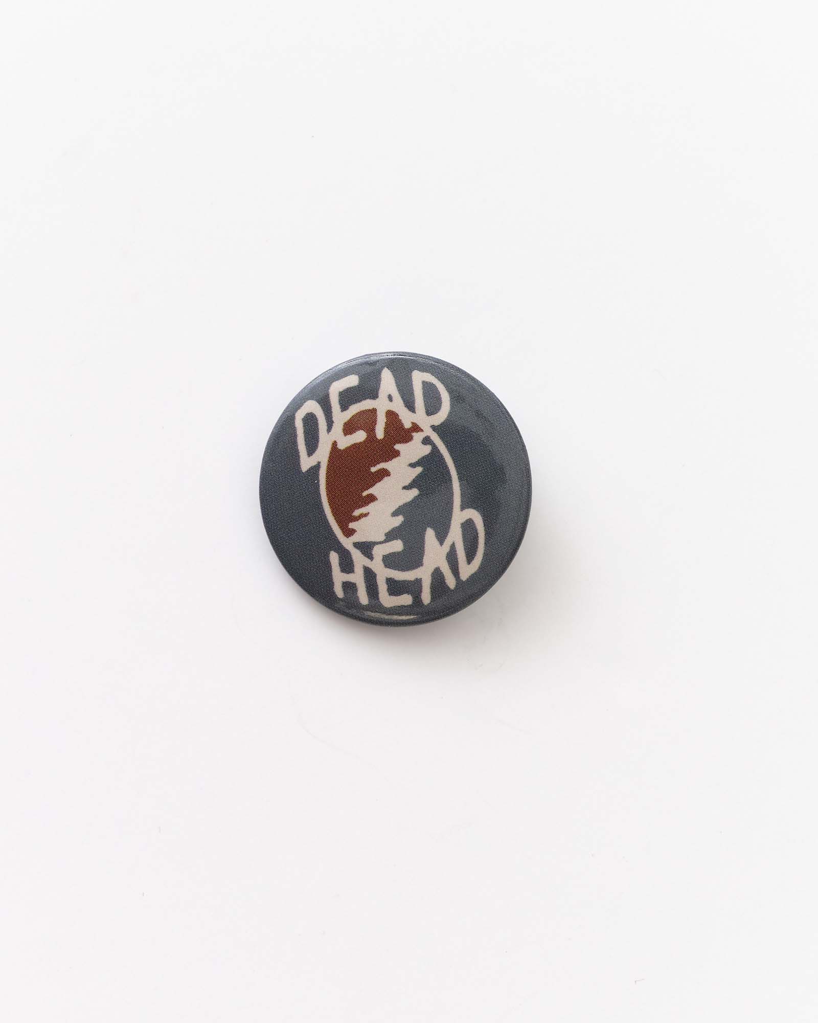 flatlay of dead head pin in The Acid Test Pin Set, Accessories by Taylor Stitch