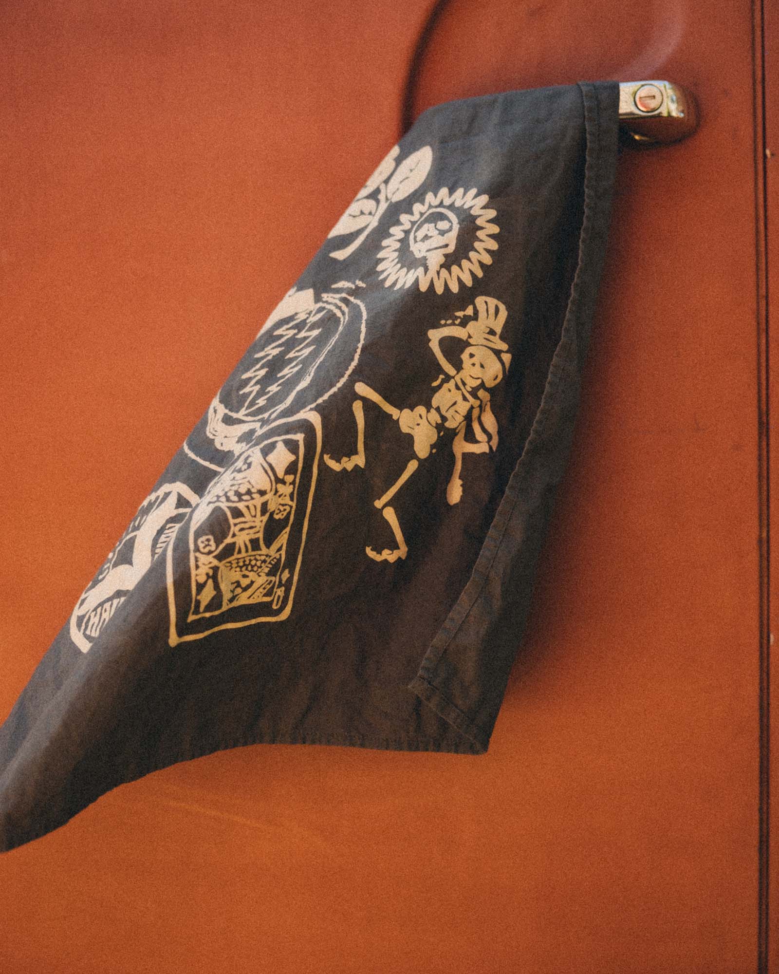 editorial image of The Bandana in Faded Black Stamp on a car, Accessories by Taylor Stitch