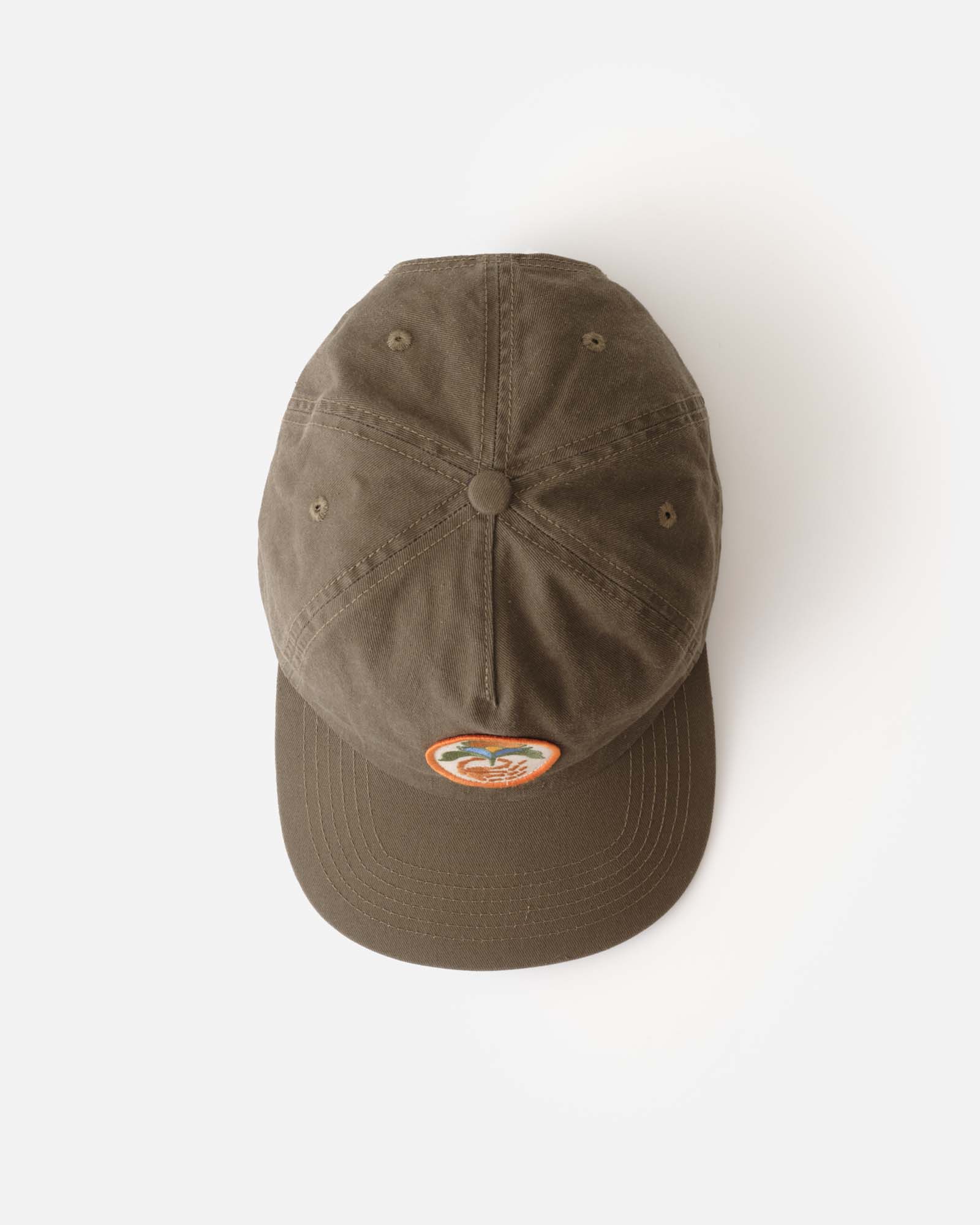 flatlay of the top of The Mercer Cap in Bud Green Twill, Accessories by Taylor Stitch