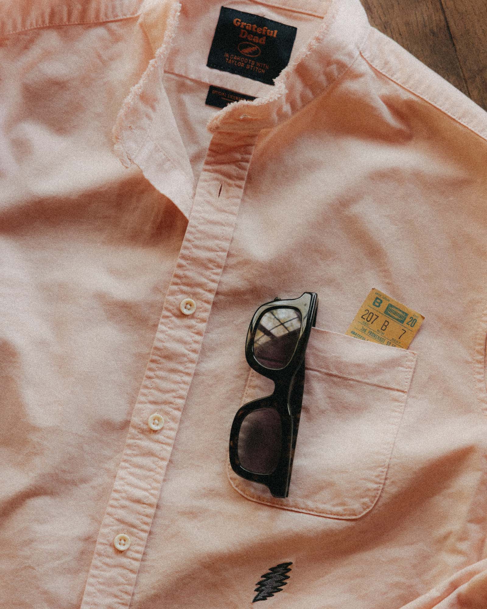 editorial flatlay of The Stageworn Jack in Pale Rose Oxford, Wovens by Taylor Stitch