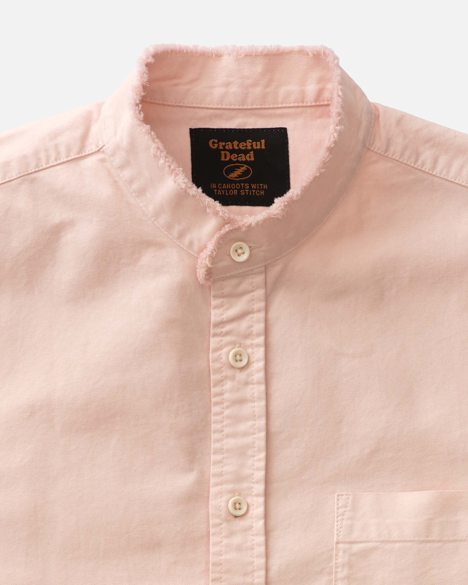 material shot of the collar on The Stageworn Jack in Pale Rose Oxford, Wovens by Taylor Stitch