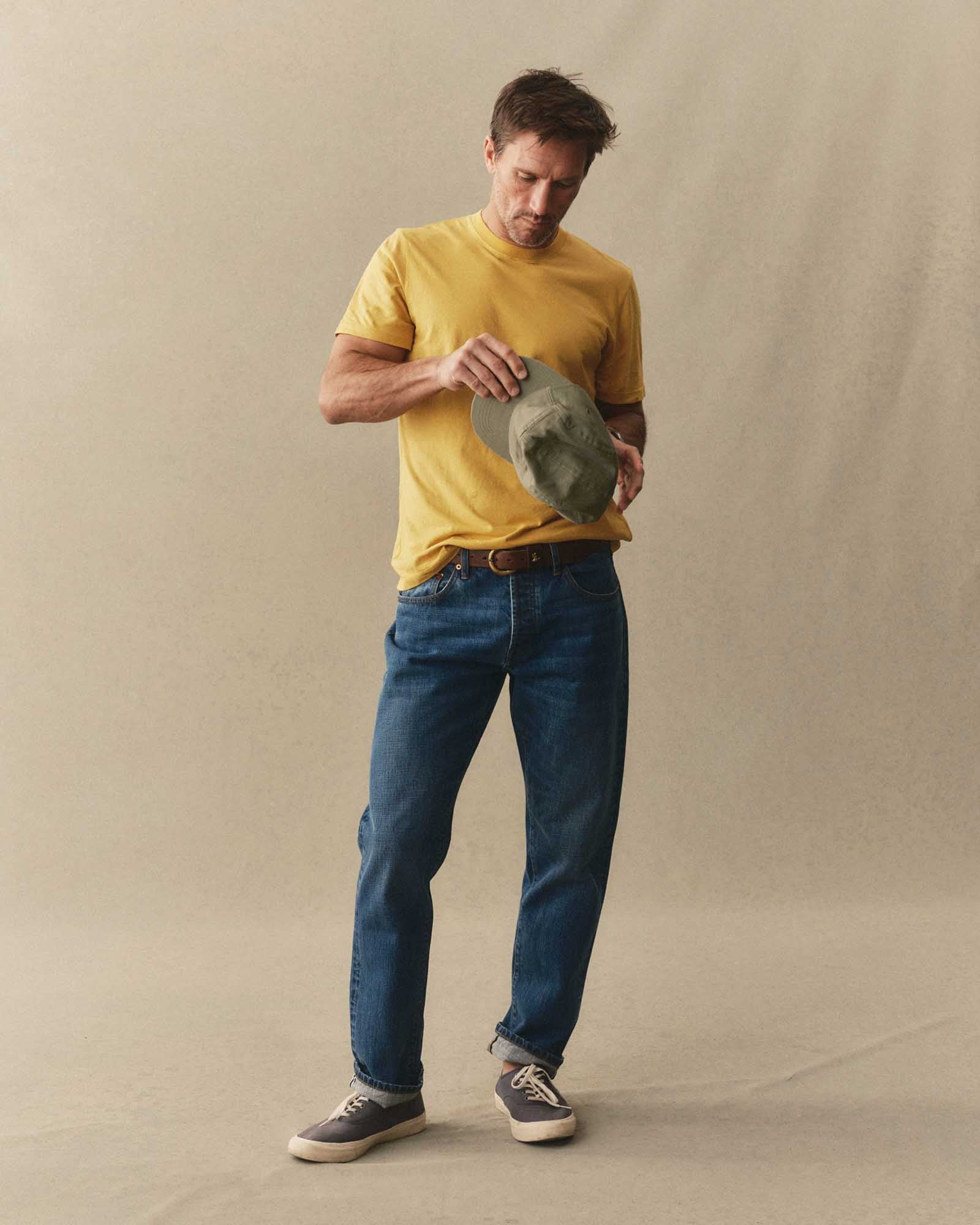 fit model posing in The Cotton Hemp Tee in Goldfinch, Knits by Taylor Stitch