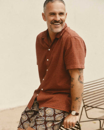 fit model sitting wearing The Davis Shirt in Driftwood Eyelet