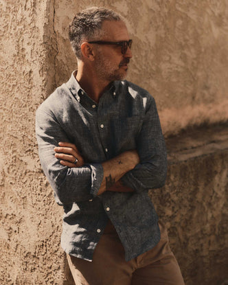 fit model leaning against the wall wearing The Jack in Ocean Linen