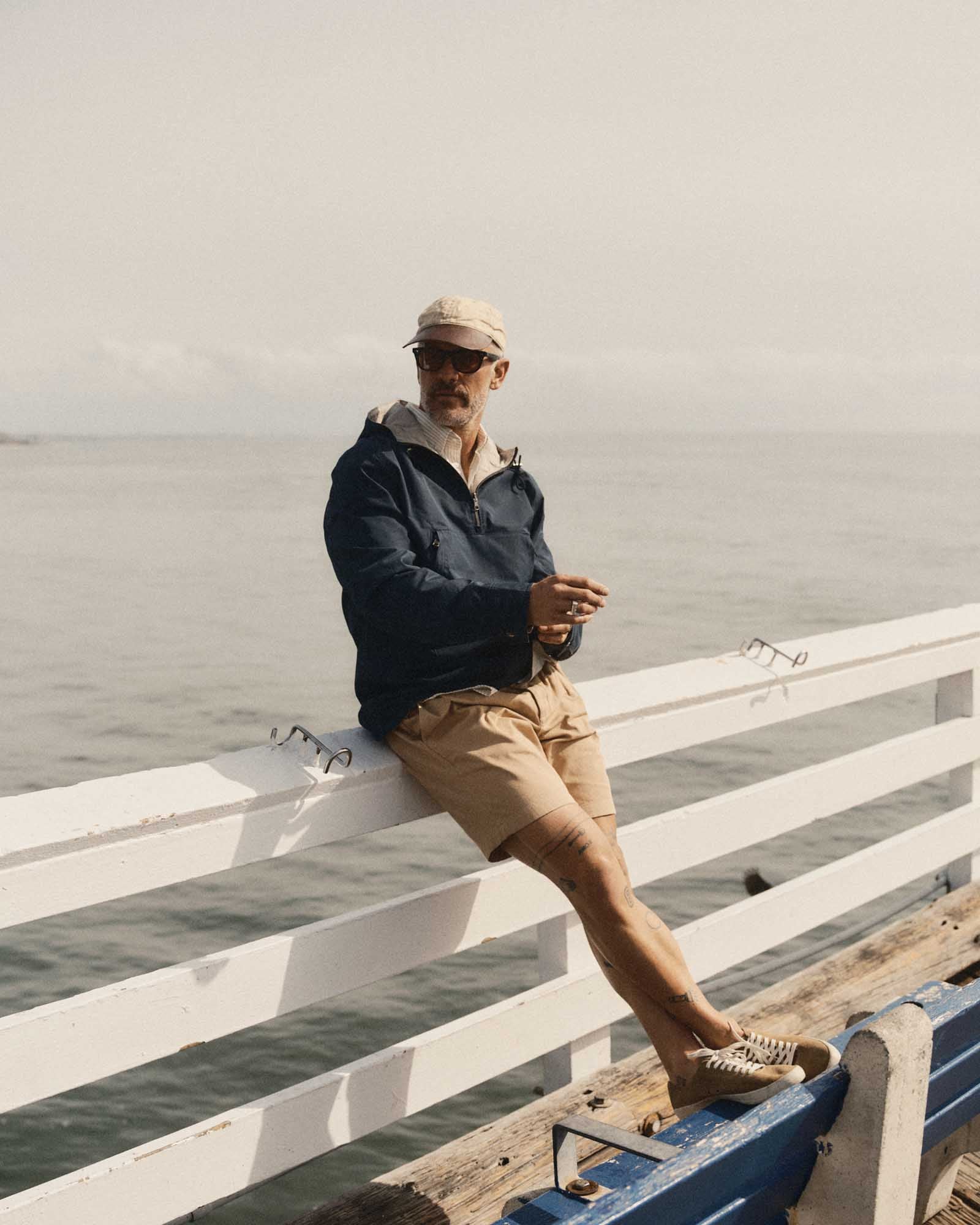 fit model posing in The Pleated Short in Organic Field Khaki Twill, Bottoms by Taylor Stitch
