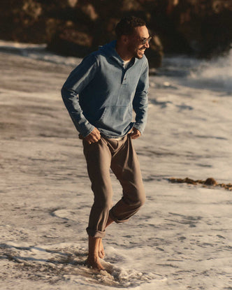 fit model walking wearing The Roamer Pant in Smoked Olive Broken Twill
