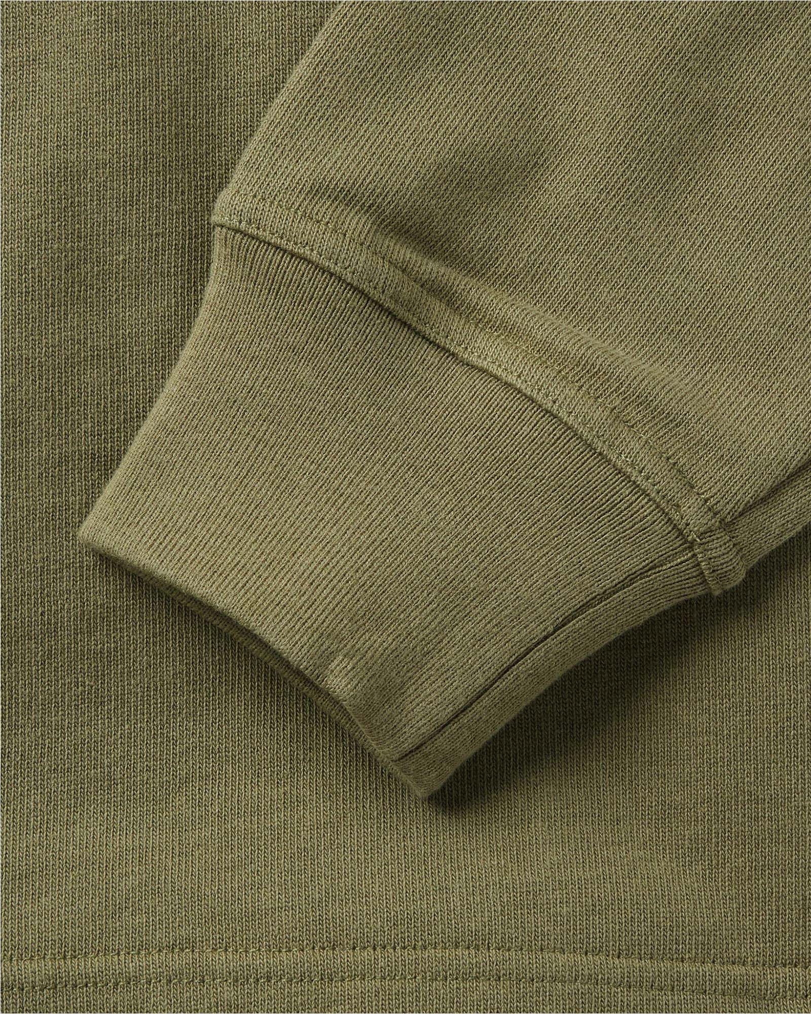 material shot of the sleeve on The Rugby Shirt in Burnt Olive, Knits by Taylor Stitch