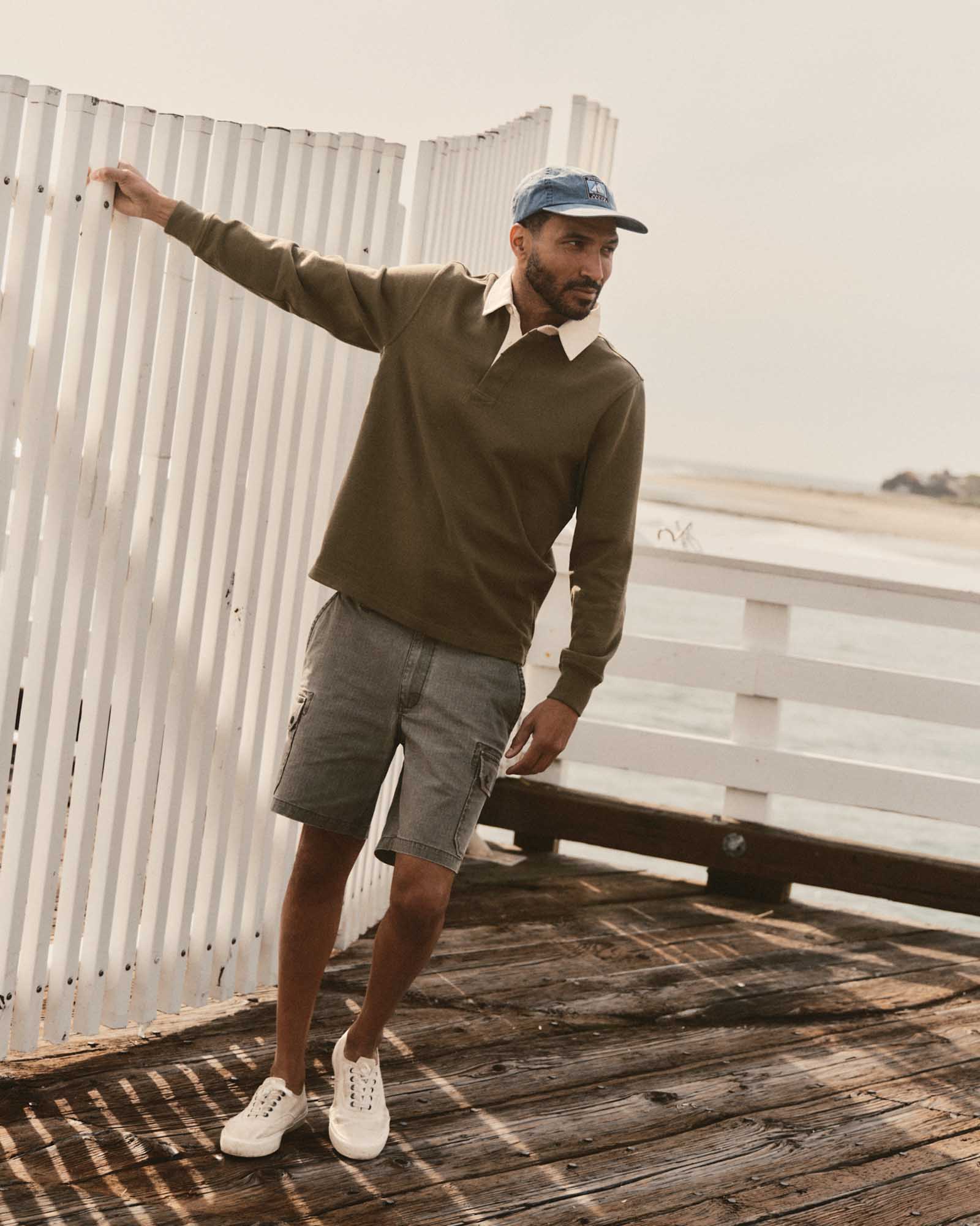 fit model posing in The Scout Short in Burnt Olive Ripstop, Bottoms by Taylor Stitch