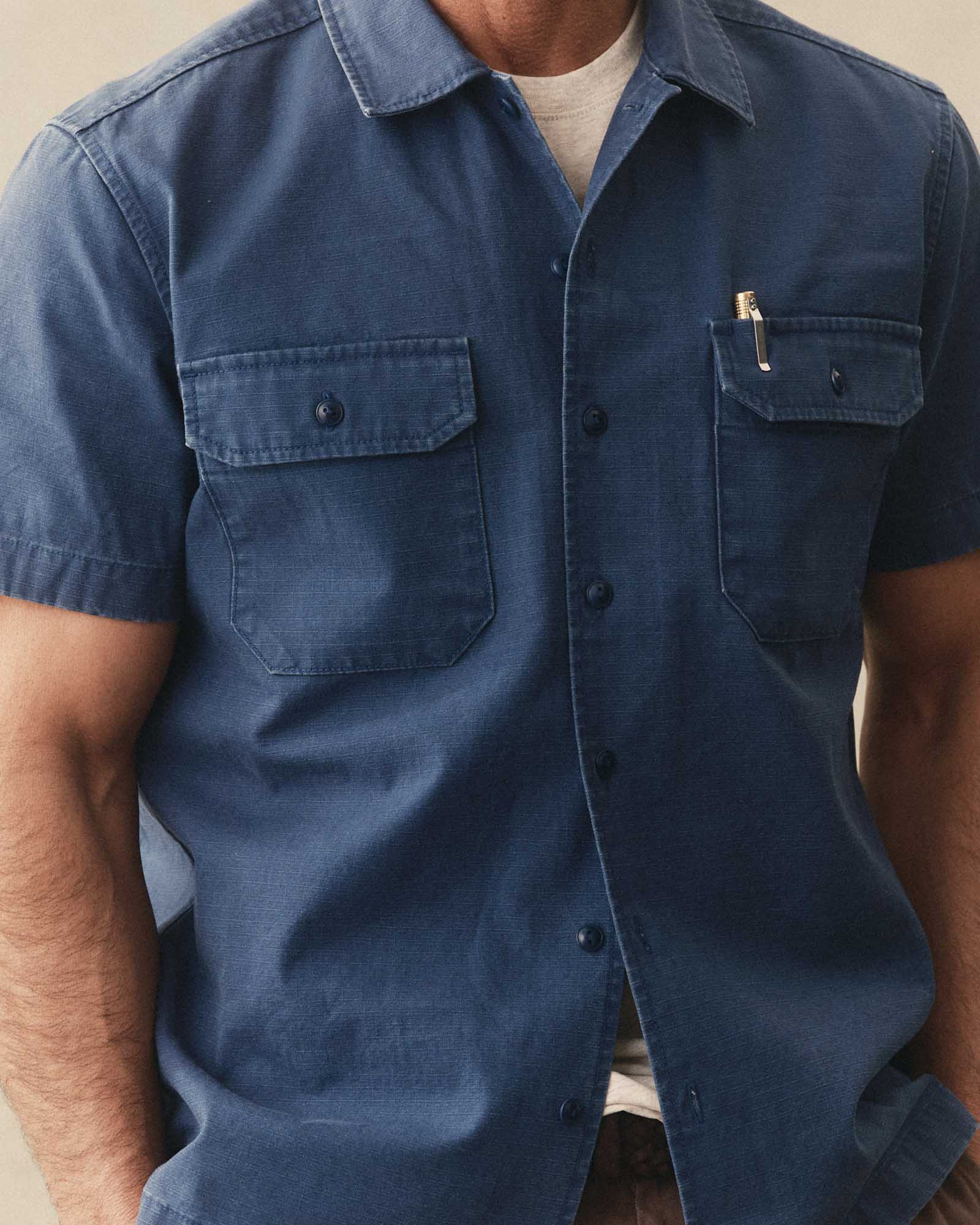 fit model posing in The Short Sleeve Mechanic Shirt in Atlantic Ripstop, Wovens by Taylor Stitch