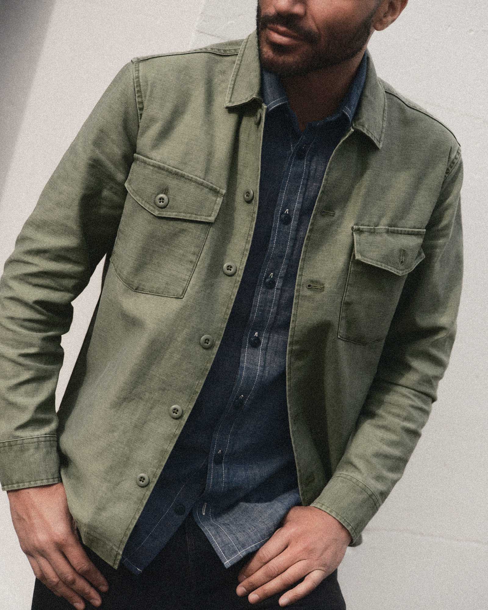 fit model posing in The Surplus Shirt in Field Olive Reverse Sateen, Wovens by Taylor Stitch