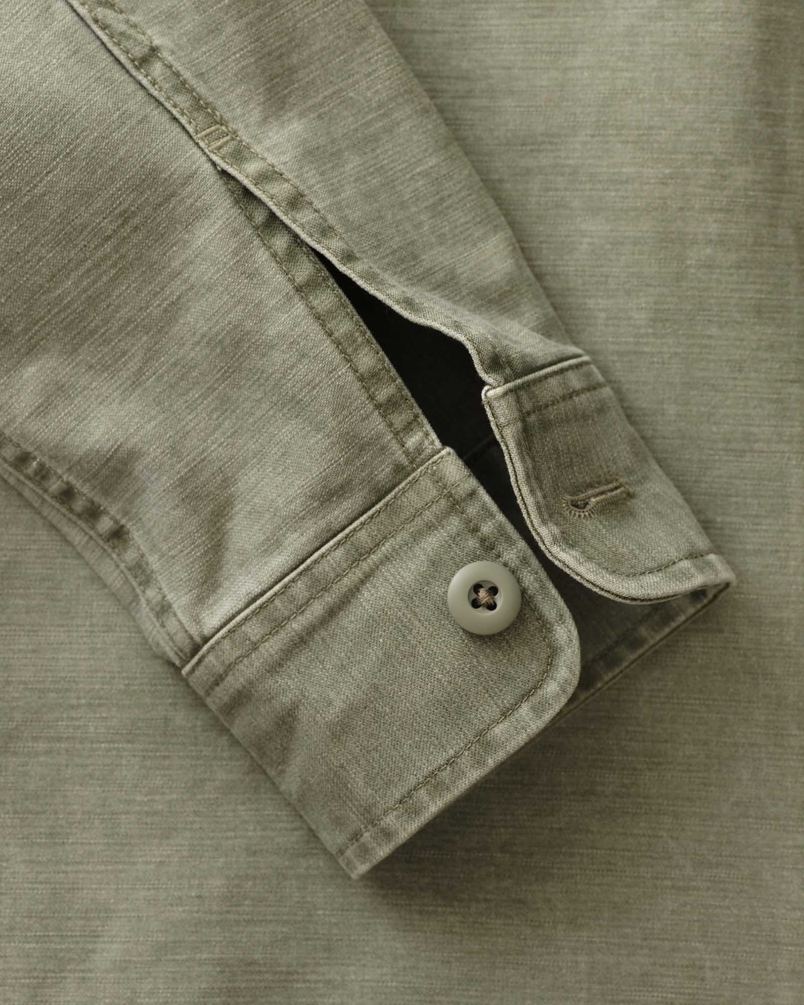 material shot of the sleeve on The Surplus Shirt in Field Olive Reverse Sateen, Wovens by Taylor Stitch