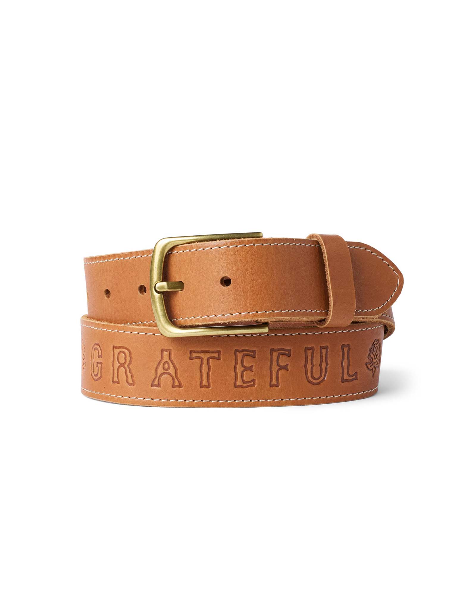 editorial image of The Tour Belt in Washed Saddle rolled up, Accessories by Taylor Stitch