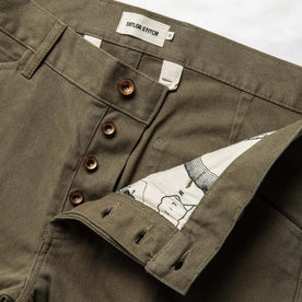 material shot of the button fly on The Chore Pant in Stone Boss Duck