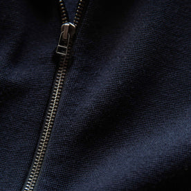 material shot of the zipper on The Portola Hoodie in Midnight Merino