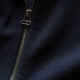 material shot of the zipper on The Portola Hoodie in Midnight Merino