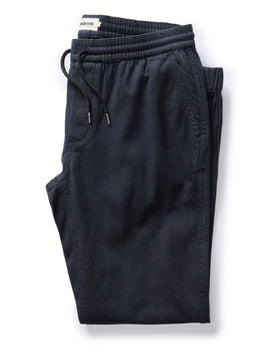 flatlay of The Apres Pant in Navy Twist Jaspe Twill folded, Bottoms by Taylor Stitch