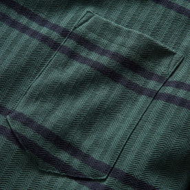 material shot of the front chest pocket on The Colton Crew in Dark Forest Stripe