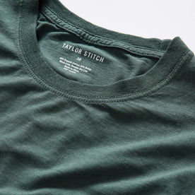 material shot of the neck opening on The Cotton Hemp Long Sleeve Tee in Dark Forest