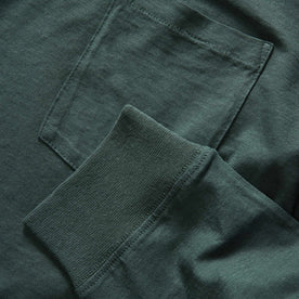 material shot of the ribbed sleeve and chest pocket on The Cotton Hemp Long Sleeve Tee in Dark Forest