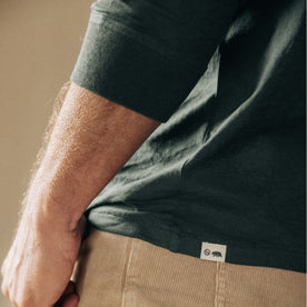 fit model showing the hem with TS label on v