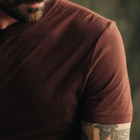fit model showing the sleeve of The Cotton Hemp Tee in Black Cherry
