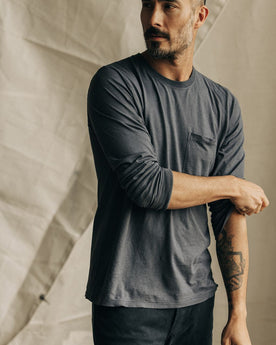fit model adjusting sleeves on The Cotton Hemp Long Sleeve Tee in Charcoal, Knits by Taylor Stitch