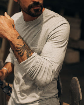 fit model showing off sleeves on The Cotton Hemp Long Sleeve Tee in Heather Grey, Knits by Taylor Stitch
