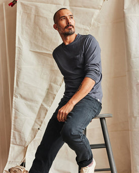 fit model posing in The Cotton Hemp Long Sleeve Tee in Navy, Knits by Taylor Stitch
