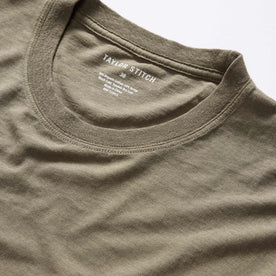 material shot of the neck opening on The Cotton Hemp Tee in Olive