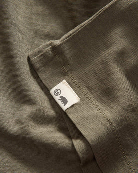material shot of the hem with the TS label on The Cotton Hemp Tee in Olive, Knits by Taylor Stitch