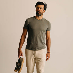 fit model showing the hem of The Cotton Hemp Tee in Olive