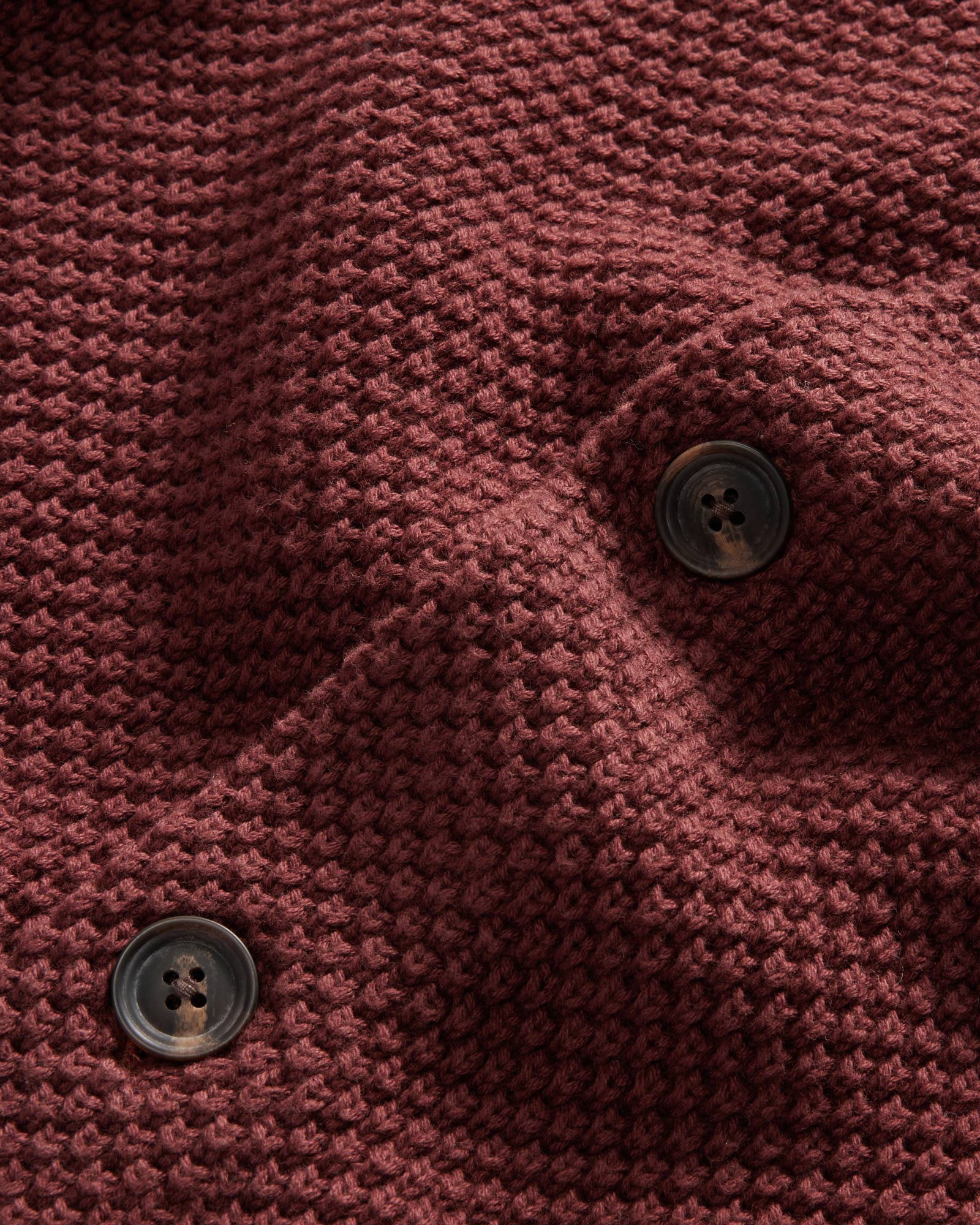 material shot of the buttons on The Crawford Sweater in Black Cherry, Knits by Taylor Stitch