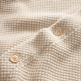 material shot of the buttons on The Crawford Sweater in Marled Natural