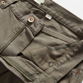 material shot of the waistband on The Democratic All Day Pant in Fatigue Olive Selvage Denim