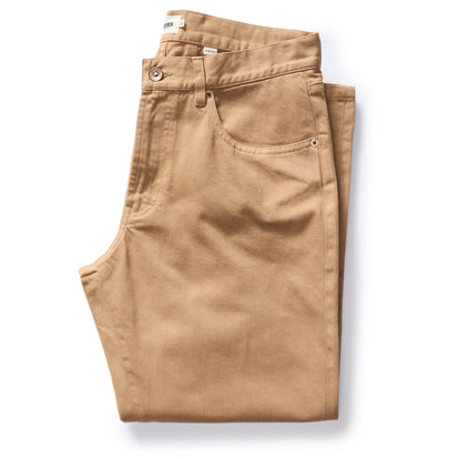 folded flay lay of The Democratic All Day Pant in Tobacco Selvage Denim