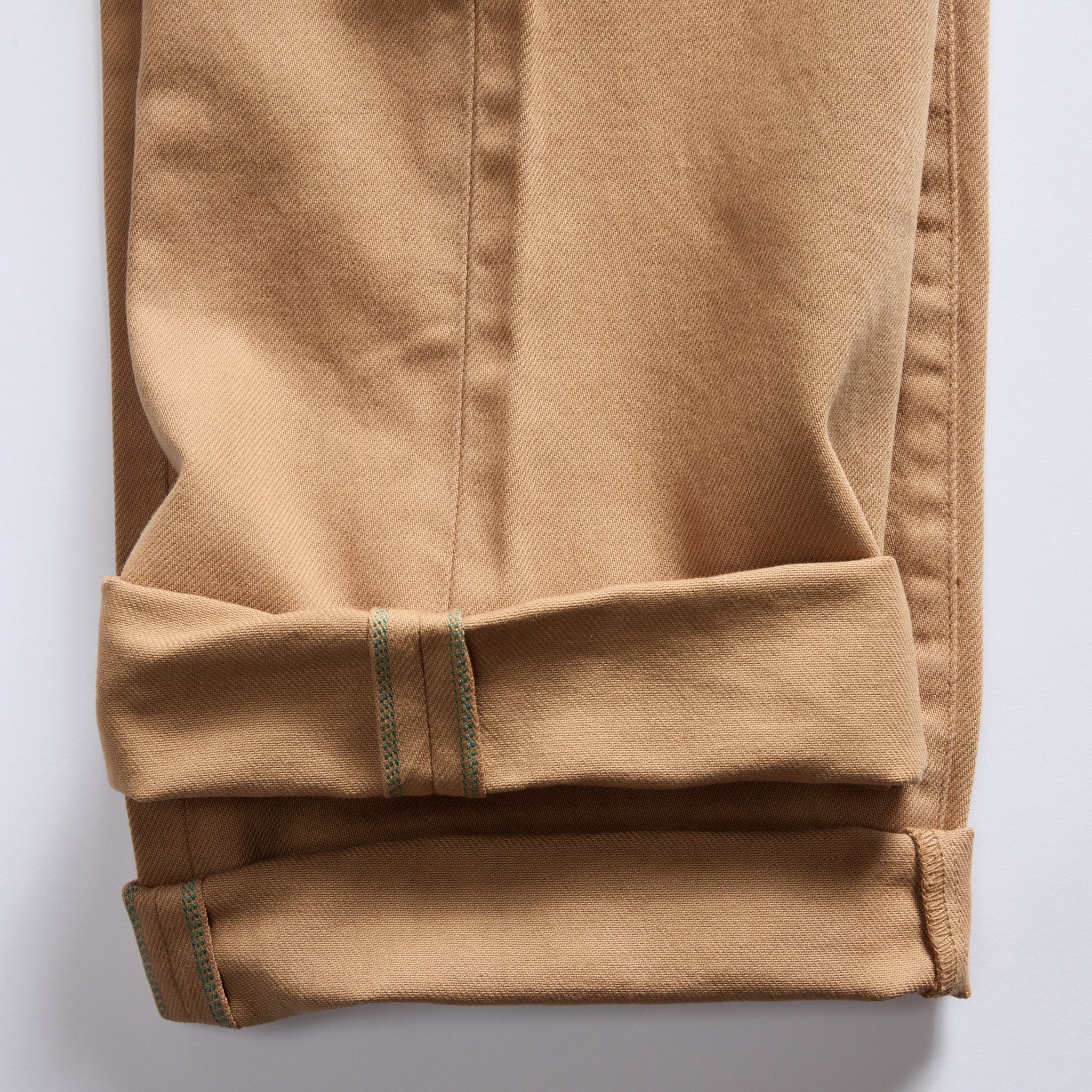 material shot of the selvage cuffs on The Democratic All Day Pant in Tobacco Selvage Denim, Bottoms by Taylor Stitch