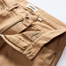 material shot of the waistband of The Democratic All Day Pant in Tobacco Selvage Denim