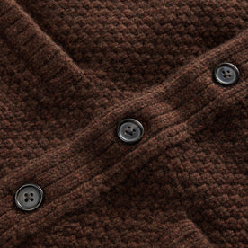 material shot of the dark horn buttons on The Fisherman Shawl Cardigan in Marsh Heather