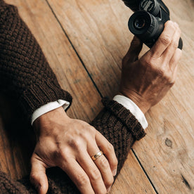 fit model showing the cuffs of The Fisherman Shawl Cardigan in Marsh Heather