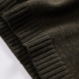 material shot of the ribbed hem on The Quarter Zip Tanker Sweater in Loden