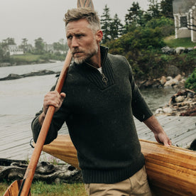 fit model carrying an oar in The Quarter Zip Tanker Sweater in Loden
